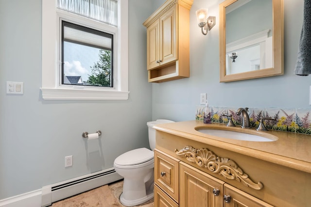 bathroom with vanity, a baseboard radiator, and toilet