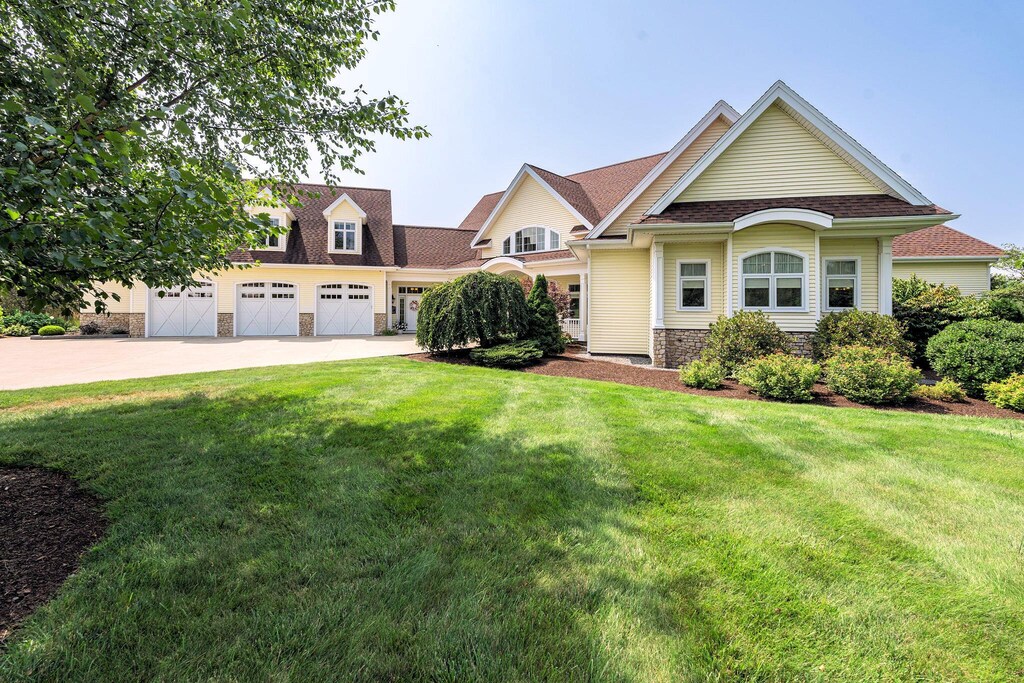 86 Peruvian Way, Bangor, ME 04401 - view of front facade with a garage and a front yard