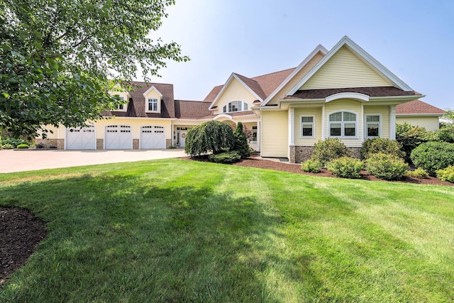 view of front facade with a garage and a front yard