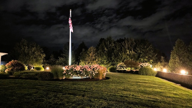 view of yard at twilight