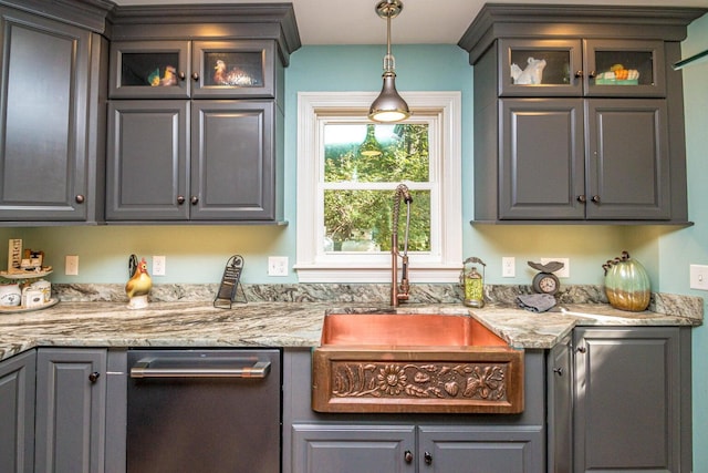 bar with light stone countertops, sink, and hanging light fixtures