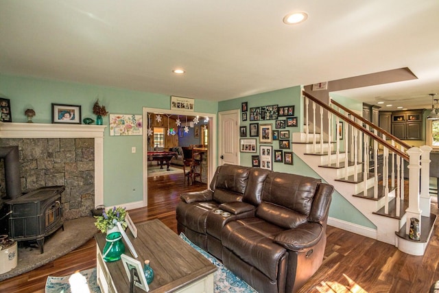 living room with a wood stove, dark wood-type flooring, and billiards