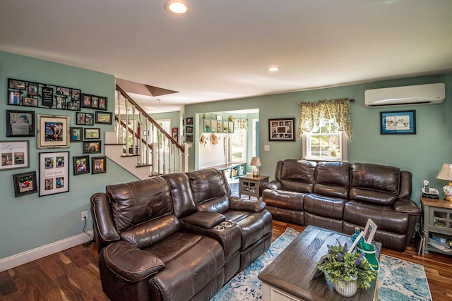 living room featuring dark hardwood / wood-style flooring and a wall mounted air conditioner