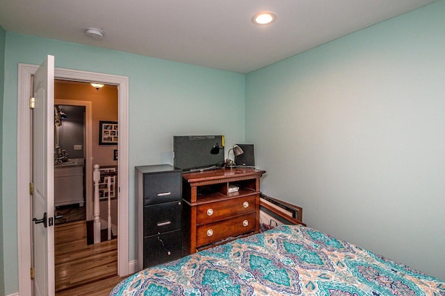 bedroom with wood-type flooring