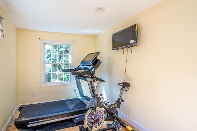 workout room with hardwood / wood-style floors