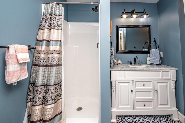 bathroom featuring tile patterned flooring, vanity, and a shower with shower curtain