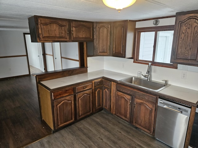 kitchen featuring dark brown cabinets, stainless steel dishwasher, and sink