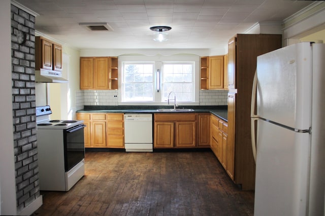 kitchen featuring decorative backsplash, dark hardwood / wood-style flooring, white appliances, and sink