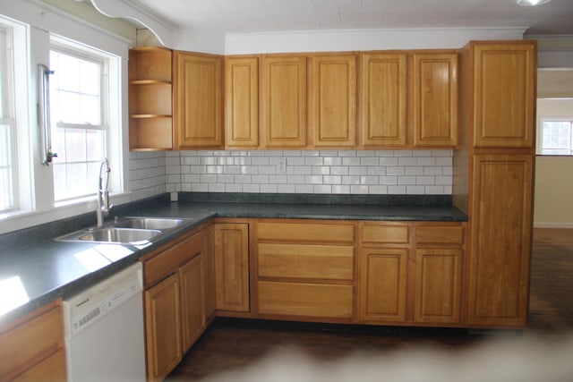 kitchen with dishwasher, sink, ornamental molding, and backsplash