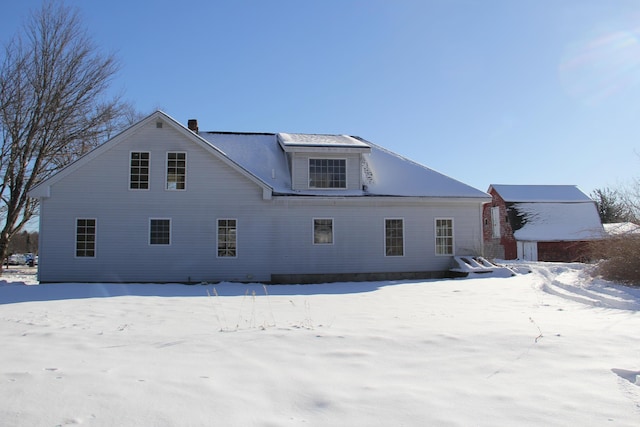 view of snow covered house