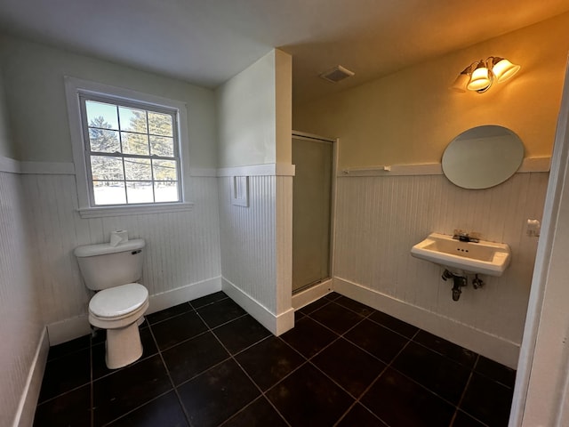 bathroom featuring tile patterned floors, sink, and a shower with shower door