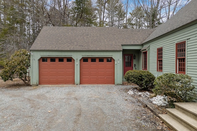 35 Cushman Rd, Nobleboro, ME 04555 - view of front facade with a shingled roof, gravel driveway, and a garage
