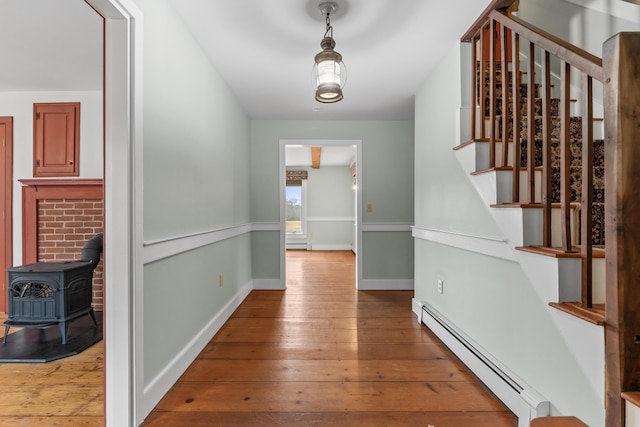 35 Cushman Rd, Nobleboro, ME 04555 - hallway with hardwood / wood-style floors, baseboards, stairway, and baseboard heating