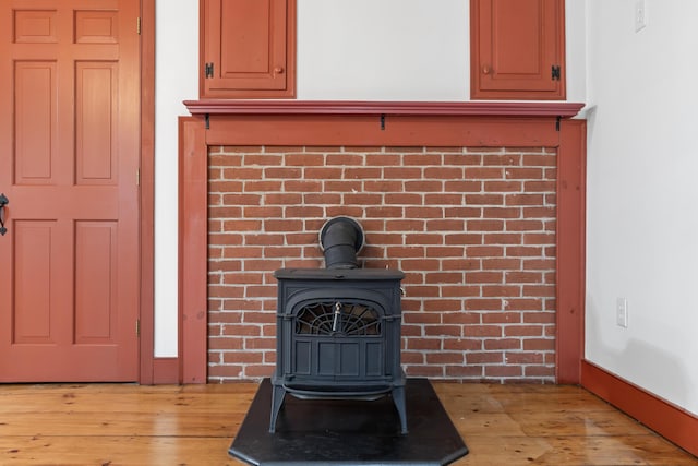 35 Cushman Rd, Nobleboro, ME 04555 - room details with wood finished floors and a wood stove