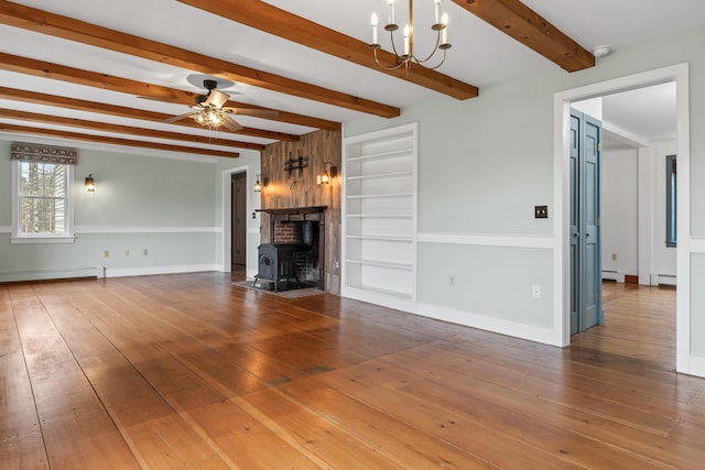 35 Cushman Rd, Nobleboro, ME 04555 - unfurnished living room with wood-type flooring, baseboard heating, built in features, ceiling fan with notable chandelier, and a baseboard heating unit