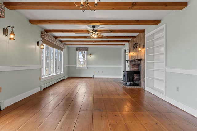 35 Cushman Rd, Nobleboro, ME 04555 - unfurnished living room with a baseboard radiator, baseboards, ceiling fan, and wood-type flooring