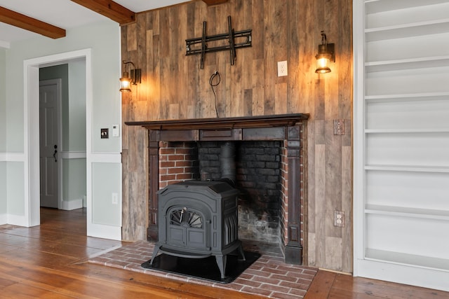 35 Cushman Rd, Nobleboro, ME 04555 - room details featuring built in features, wood finished floors, a wood stove, and wood walls