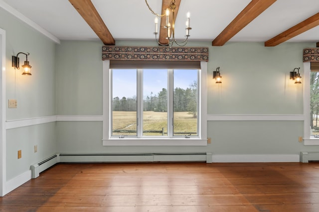 35 Cushman Rd, Nobleboro, ME 04555 - unfurnished dining area featuring an inviting chandelier, a baseboard heating unit, and hardwood / wood-style flooring