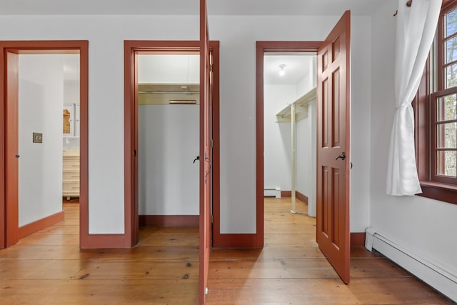 35 Cushman Rd, Nobleboro, ME 04555 - bedroom featuring a baseboard heating unit, light wood-type flooring, baseboards, a baseboard radiator, and a closet