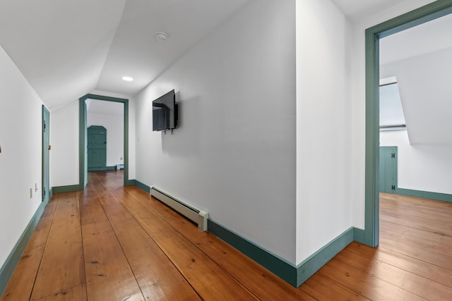 35 Cushman Rd, Nobleboro, ME 04555 - corridor featuring baseboards, lofted ceiling, light wood-style flooring, and a baseboard heating unit