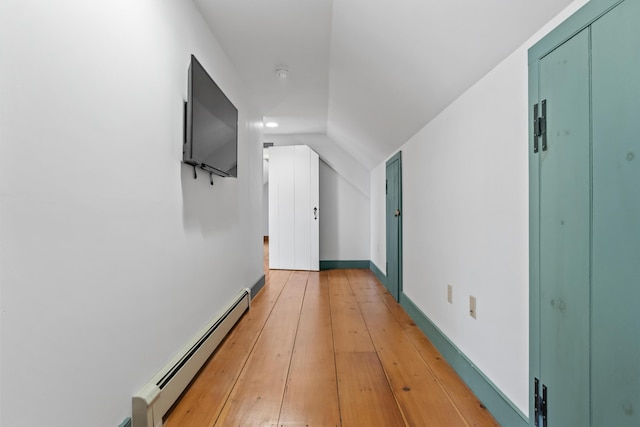 35 Cushman Rd, Nobleboro, ME 04555 - corridor featuring light wood finished floors, a baseboard radiator, vaulted ceiling, and baseboards