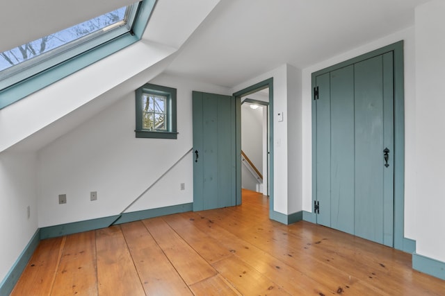35 Cushman Rd, Nobleboro, ME 04555 - bonus room featuring baseboards, light wood-style flooring, and lofted ceiling with skylight
