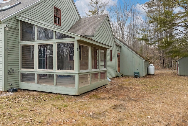 35 Cushman Rd, Nobleboro, ME 04555 - view of side of home featuring a sunroom and a shingled roof