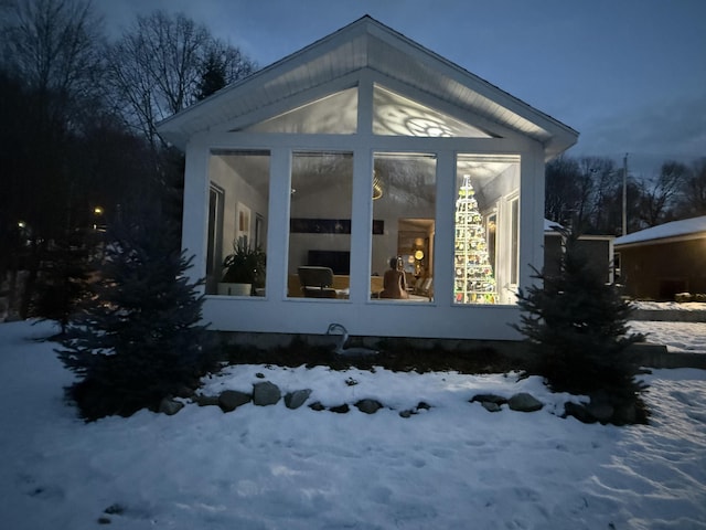 exterior space featuring a sunroom