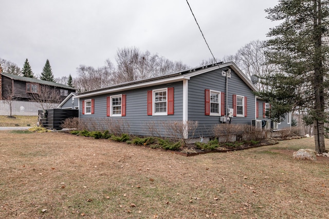 view of home's exterior featuring a yard