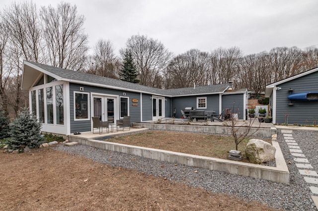 back of house featuring a patio and french doors