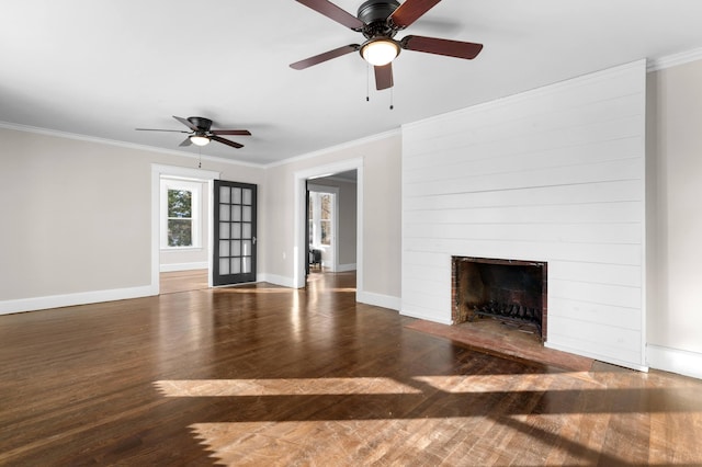 unfurnished living room with crown molding, dark hardwood / wood-style flooring, and ceiling fan