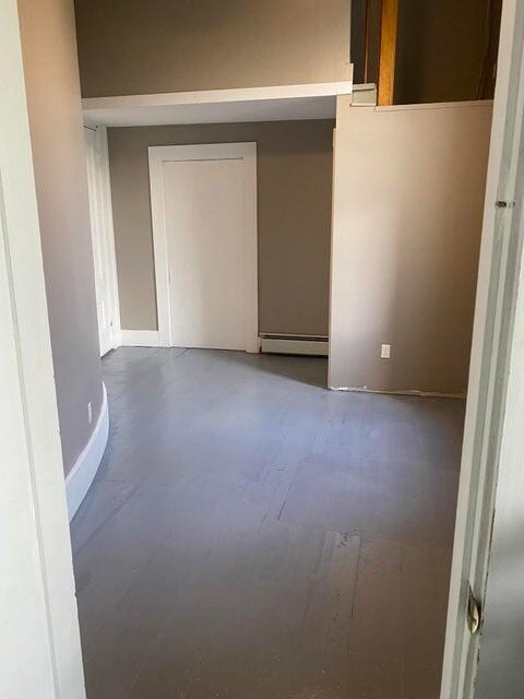 spare room with a baseboard heating unit