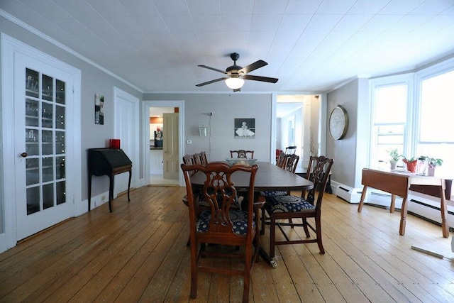 dining space with wood-type flooring, ceiling fan, and ornamental molding