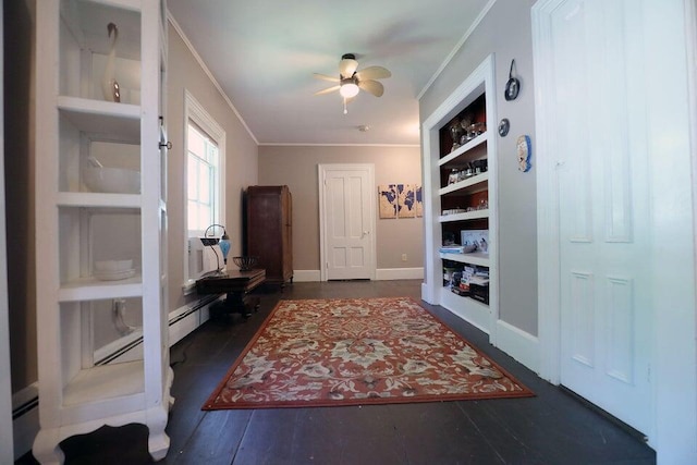 interior space with ceiling fan, built in features, dark wood-type flooring, and ornamental molding