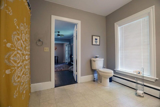 bathroom featuring toilet and baseboard heating