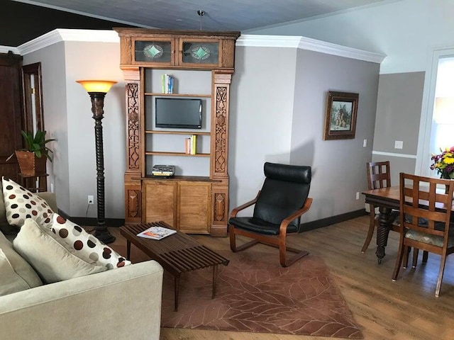 living room with crown molding and dark hardwood / wood-style flooring