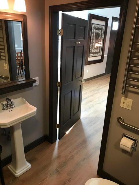 bathroom with hardwood / wood-style flooring