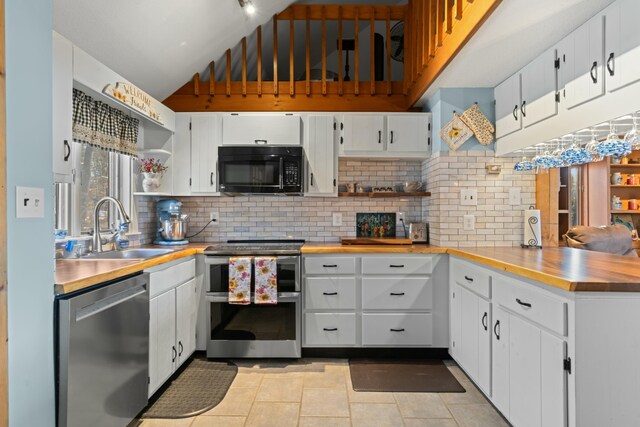151 Mountain View Dr, Acton, ME 04001 - kitchen with sink, white cabinetry, stainless steel appliances, and tasteful backsplash
