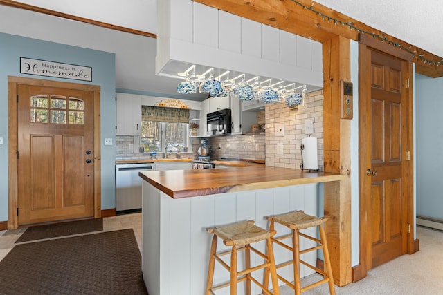 151 Mountain View Dr, Acton, ME 04001 - kitchen with dishwasher, a kitchen bar, kitchen peninsula, and decorative backsplash