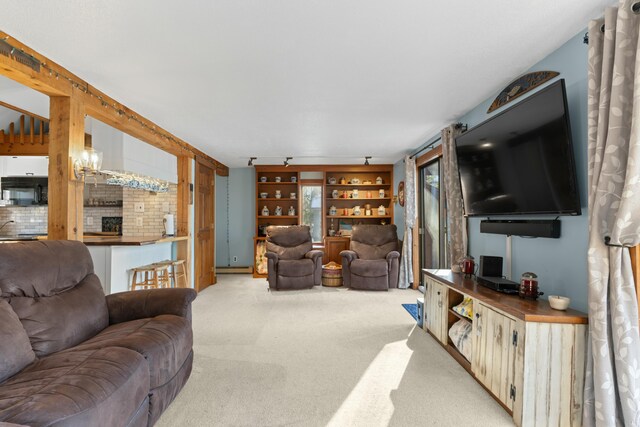 151 Mountain View Dr, Acton, ME 04001 - living room featuring a fireplace and light carpet