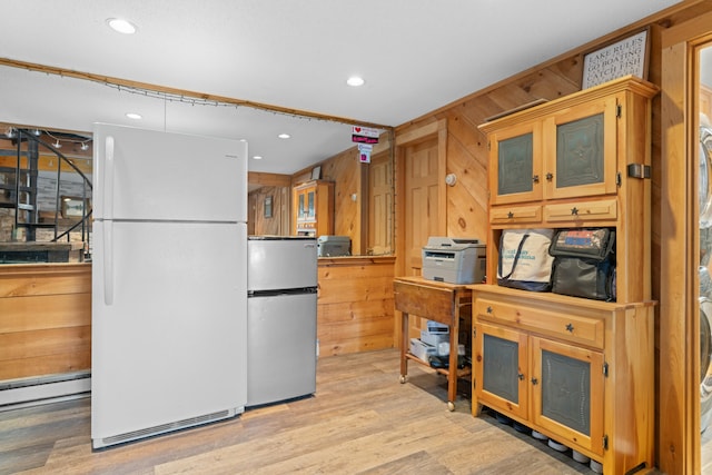 151 Mountain View Dr, Acton, ME 04001 - kitchen featuring stainless steel fridge, white refrigerator, light hardwood / wood-style floors, and wood walls