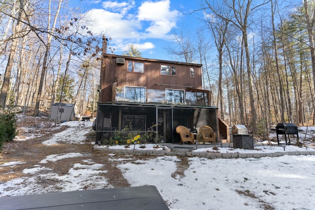 151 Mountain View Dr, Acton, ME 04001 - snow covered rear of property with a balcony and a storage shed