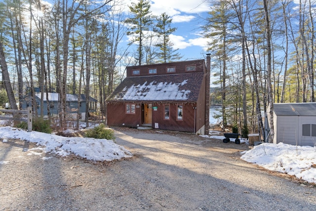 view of front of property with an outdoor structure