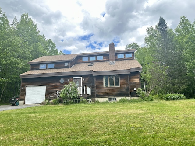 119 Fenderson Hill Hill N, Wilton, ME 04294 - view of front of home featuring a front lawn, a shingled roof, a garage, and asphalt driveway