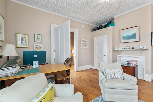 office space featuring light hardwood / wood-style flooring and ornamental molding