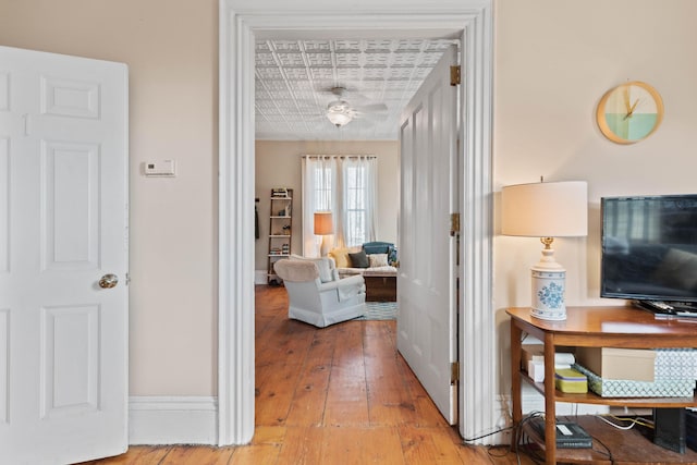 hall with wood-type flooring