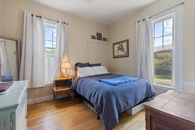 bedroom with light hardwood / wood-style floors