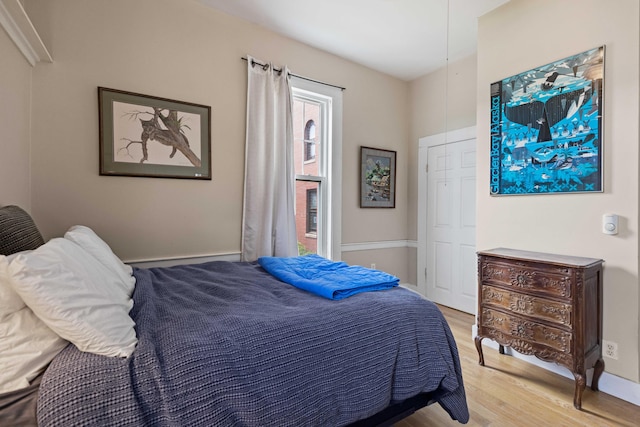 bedroom with light hardwood / wood-style flooring