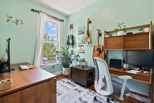 office with light hardwood / wood-style floors