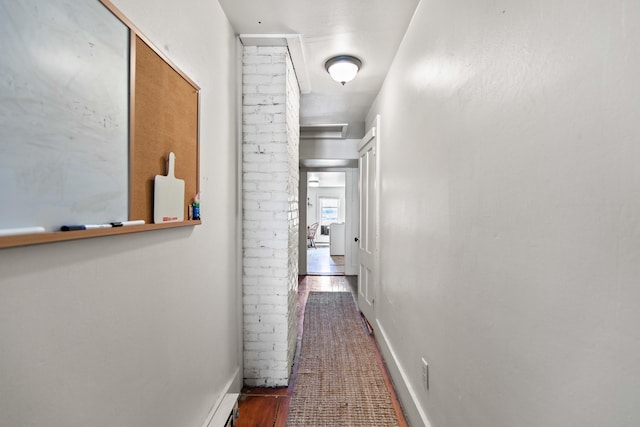 hall with wood-type flooring